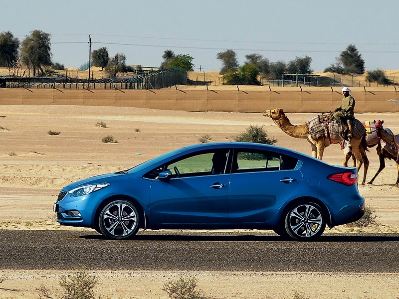 Kia Cerato 2013 вид сбоку